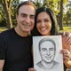 James R. and his partner holding a hand-drawn Eva Bloom Soulmate Sketch portrait outdoors in a park